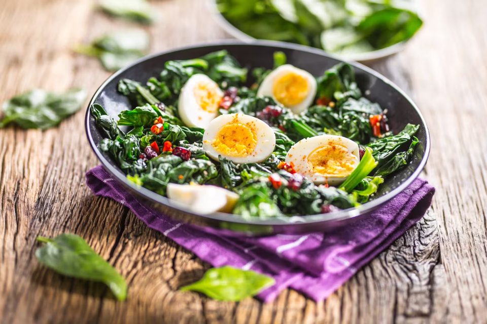 Fresh Spinach Salad with Eggs, Chili Pepper, and Sweet Cranberries