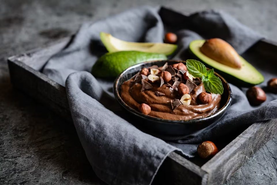 Raw Avocado Chocolate Mousse Topped with Hazelnuts