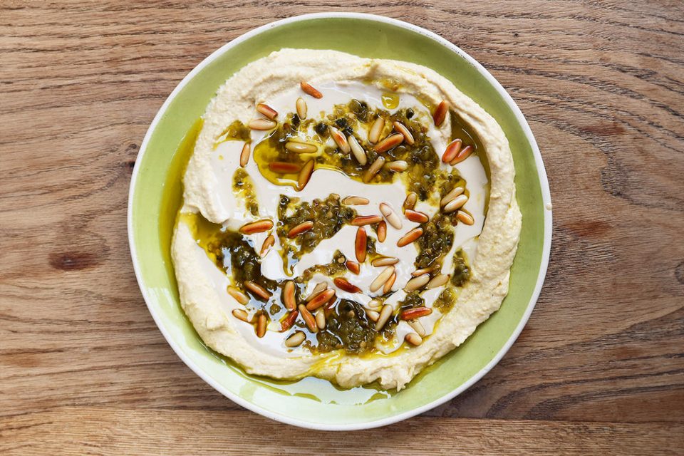 Tahini and green chilli shattah hummus topping