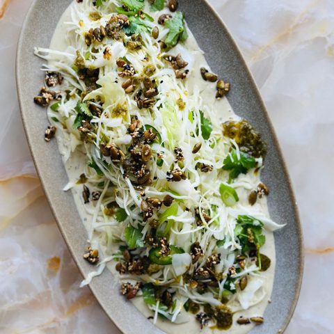 Green harissa and tahini slaw with pumpkin seed brittle