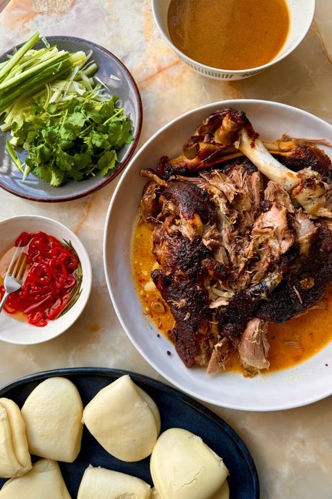 Sticky lamb bao with pickled chilli and coriander